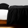 Linen Duvet Cover | Corvino | duvet cover neatly arranged over white sheeting - side view.