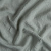 Linen Twin Duvet Cover | Eucalyptus | A close up of linen fabric in eucalyptus, a soft light green.