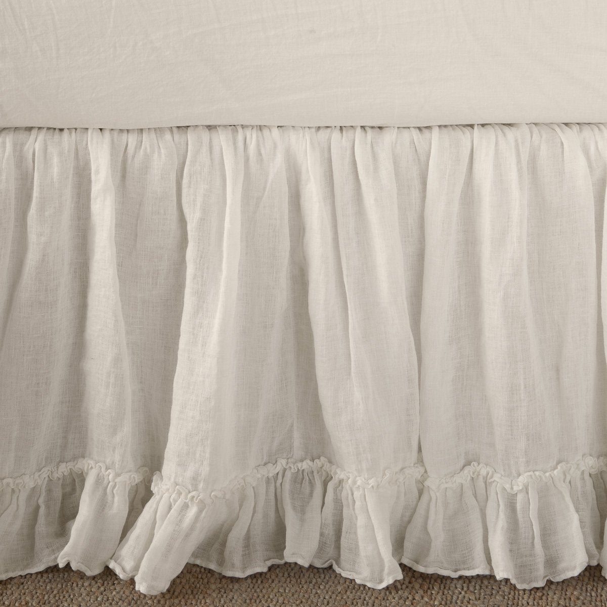 Linen Whisper Bed Skirt | Parchment | Close up of bed skirt, showcasing ruffle detail - side view.