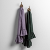 Linen Whisper Guest Towel | pair of guest towels in our 2024 new colors hanging from decorative towel hooks against a white wall.