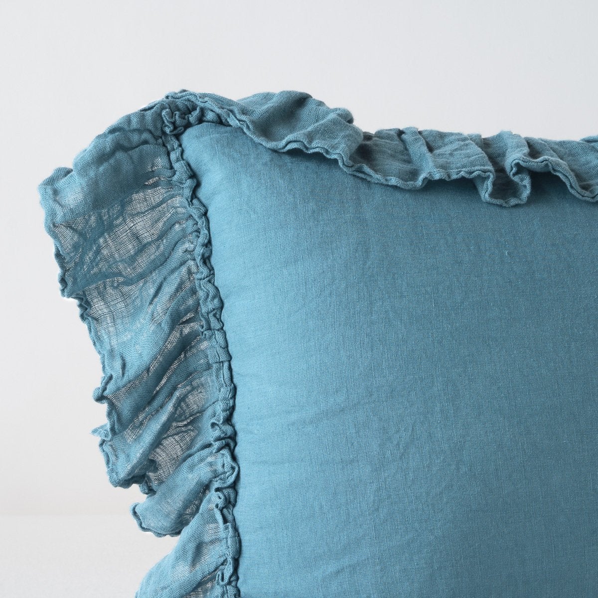 Cenote | Corner detail close-up of Linen Whisper sham, showcasing slight translucence of ruffle trim detail - cenote.