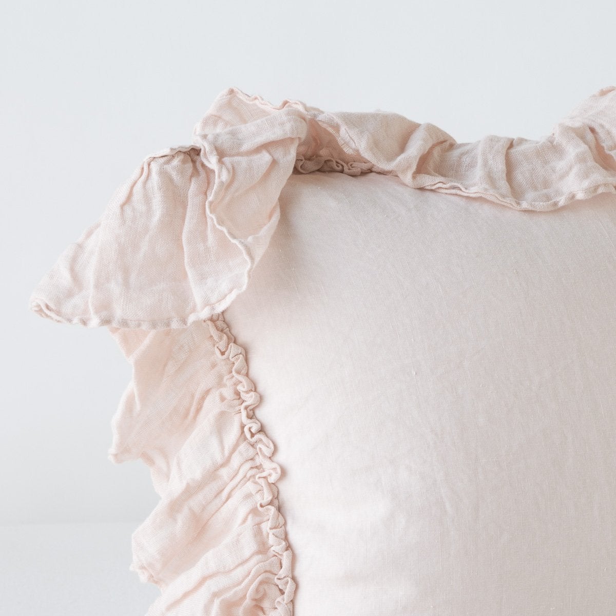 Pearl | Corner detail close-up of Linen Whisper sham, showcasing ruffle trim detail - pearl.