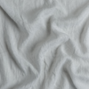 Linen Whisper Baby Blanket | Cloud | A close up of linen whisper fabric in cloud, a soft, subtle sky blue-grey.