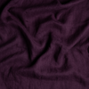 Linen Whisper Baby Blanket | Fig | A close up of linen whisper fabric in fig, a richly saturated purple-garnet.