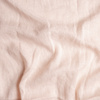 Linen Whisper Baby Blanket | Pearl | A close up of linen whisper fabric in pearl, a nude-like, soft rose pink tone.