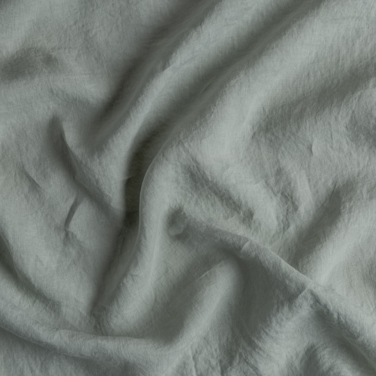 Linen Duvet Cover | Eucalyptus | A close up of linen fabric in eucalyptus, a soft light green.
