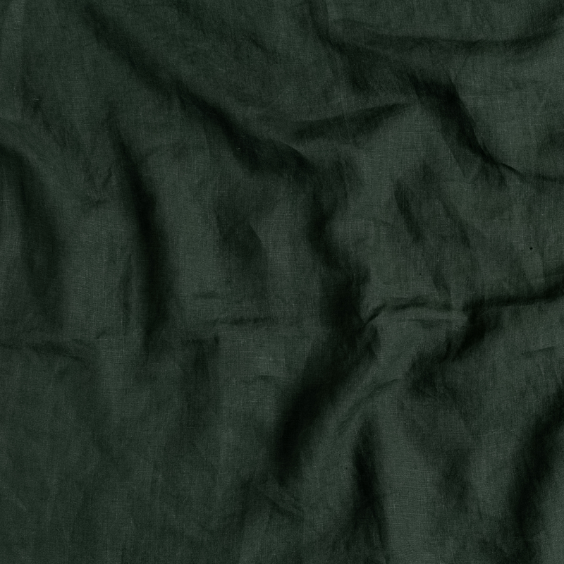 Linen Standard Pillowcase (Single) | Juniper | A close up of linen fabric in Juniper, a deep green tone.