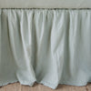 Linen Bed Skirt | Eucalyptus | Close-up of bed skirt, featuring its softly gathered design.