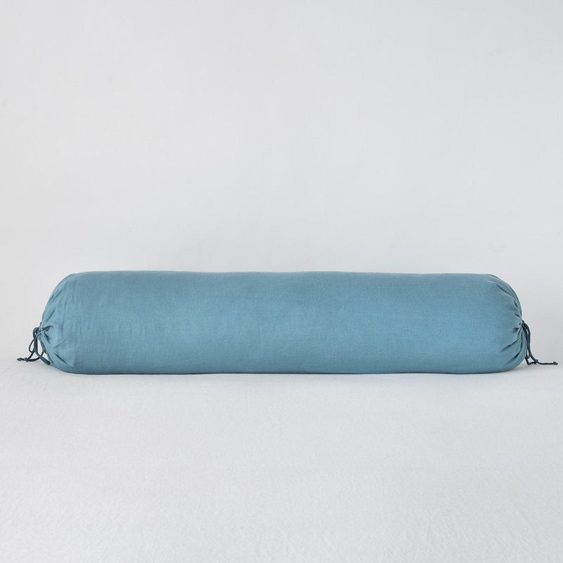 Linen Throw Pillow | Cenote | bolster against a white background.