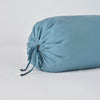 Linen Throw Pillow | Close-up of Linen bolster end detail in cenote, angled to show gathering and satin ties.