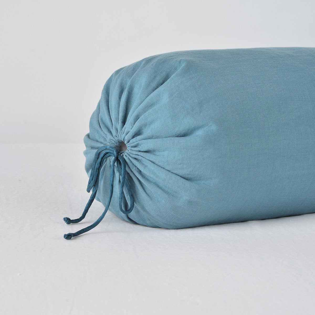 https://www.bellanottelinens.com/cdn/shop/products/Linen_Bolster_Cenote_Bella_Notte_2_cd28b976-bdc9-486e-a8c9-f68cd70368e3_2048x2048.jpg?v=1703613227