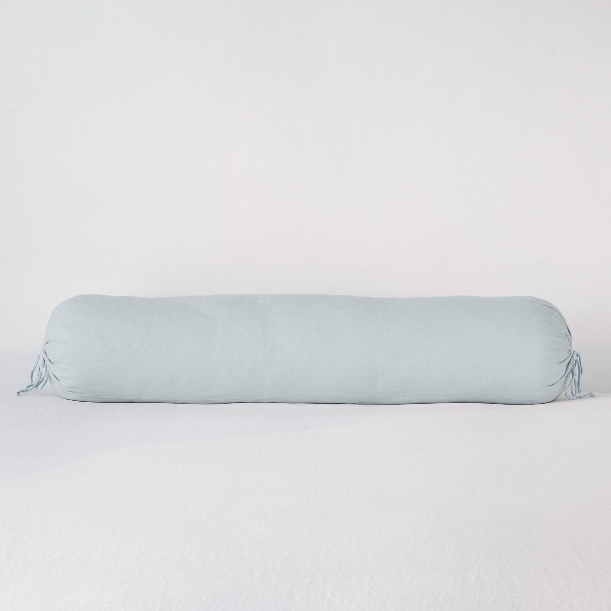 Linen Throw Pillow | Cloud | bolster against a white background.