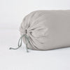 Linen Throw Pillow | Fog | Close-up bolster end detail, angled view to show gathered closure and satin ties.