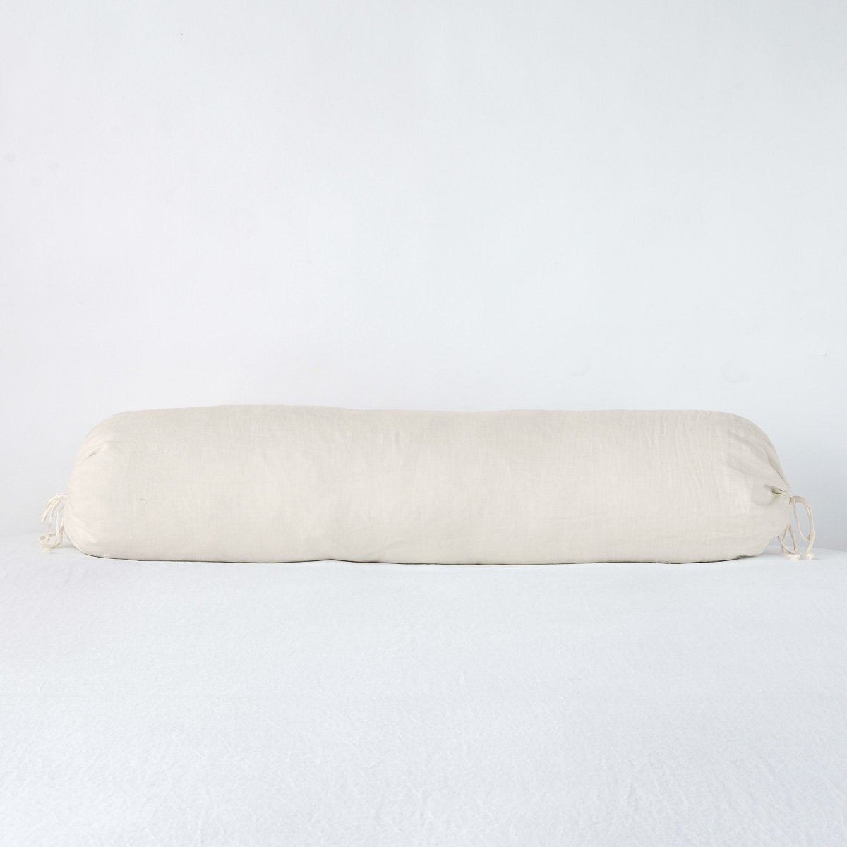 https://www.bellanottelinens.com/cdn/shop/products/Linen_Bolster_Parchment_Bella_Notte_1_f98491fd-978e-4df6-8e82-c33336758526_2048x2048.jpg?v=1703613227