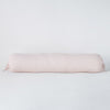 Linen Throw Pillow | Pearl | bolster against a white background.