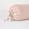 Linen Throw Pillow | Rouge | Close-up bolster end detail, angled view to show gathered closure and satin ties.
