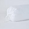 Linen Throw Pillow | White | Close-up bolster end detail, angled view to show gathered closure and satin ties.