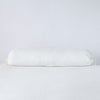 Linen Throw Pillow | Winter White | bolster against a white background.