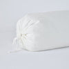 Linen Throw Pillow | Winter White | Close-up bolster end detail, angled view to show gathered closure and satin ties.
