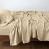 Linen Twin Fitted Sheets | Honeycomb | fitted sheet with matching rumpled flat sheet and sleeping pillow - side view.