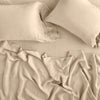Linen Fitted Sheet | Honeycomb | fitted sheet with matching rumpled flat sheet and sleeping pillows - overhead view.