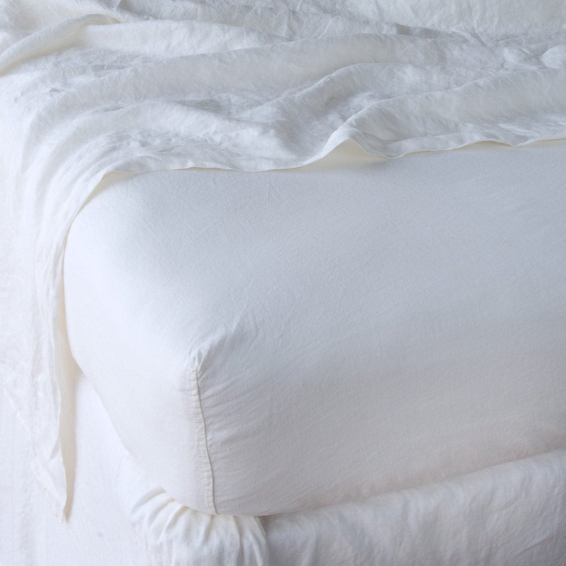 Linen Twin Fitted Sheets | White | close up of fitted sheet with matching rumpled flat sheet - corner view.