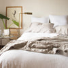 Linen Pillowcase (Single) | A soothing, neutral bed with linen pillow cases and linen quilted coverlet in fog over white linen duvet and shams - end of bed view.