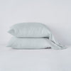 Linen Pillowcase (Single) | Cloud | Two sleeping pillows neatly stacked against a white background - side view.