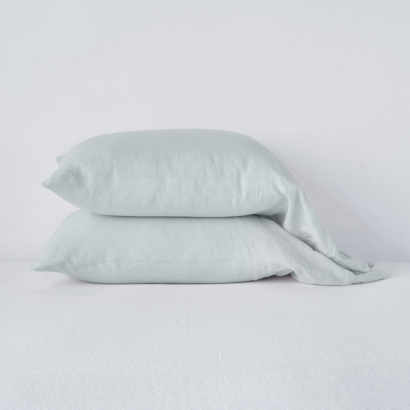Linen Standard Pillowcase (Single) | Cloud | Two sleeping pillows neatly stacked against a white background - side view.