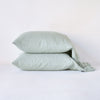 Linen Pillowcase (Single) | Eucalyptus | Two sleeping pillows neatly stacked against a white background - side view.
