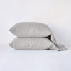 Linen Pillowcase (Single) | Two linen slepping pillows in fog, stacked neatly against a plain background - side view.