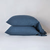 Linen Standard Pillowcase (Single) | Midnight | Two sleeping pillows neatly stacked against a white background - side view.