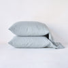 Linen Standard Pillowcase (Single) | Mineral | Two sleeping pillows neatly stacked against a white background - side view.