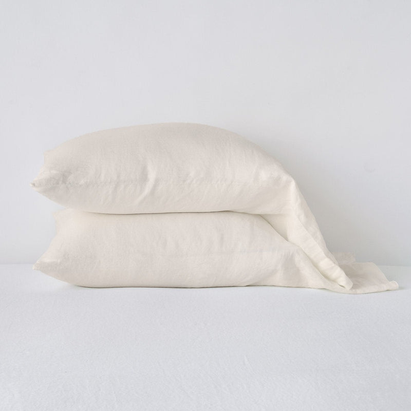 Linen Standard Pillowcase (Single) | Parchment | Two sleeping pillows neatly stacked against a white background - side view.
