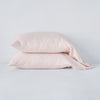Linen Pillowcase (Single) | Pearl | Two sleeping pillows neatly stacked against a white background - side view.
