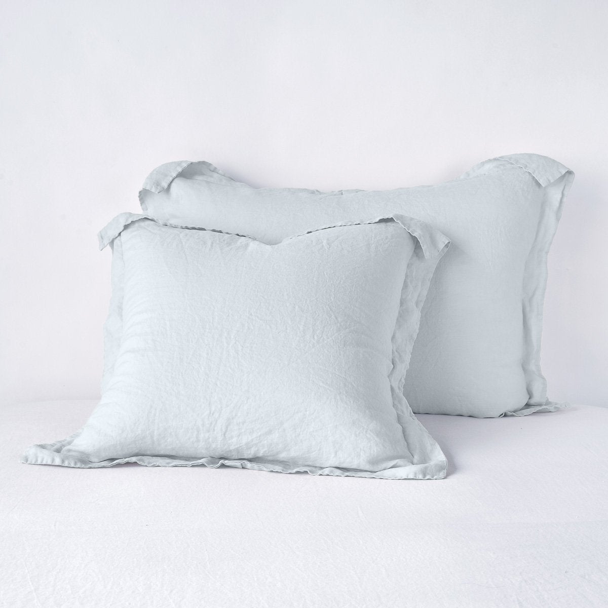 Linen Sham | Cloud | Two shams leaning upright against a white background.