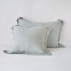 Linen Sham | Eucalyptus | Two shams leaning upright against a white background.