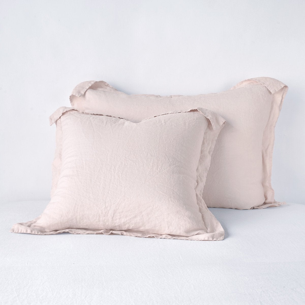 Linen Sham | Pearl | Two shams leaning upright against a white background.