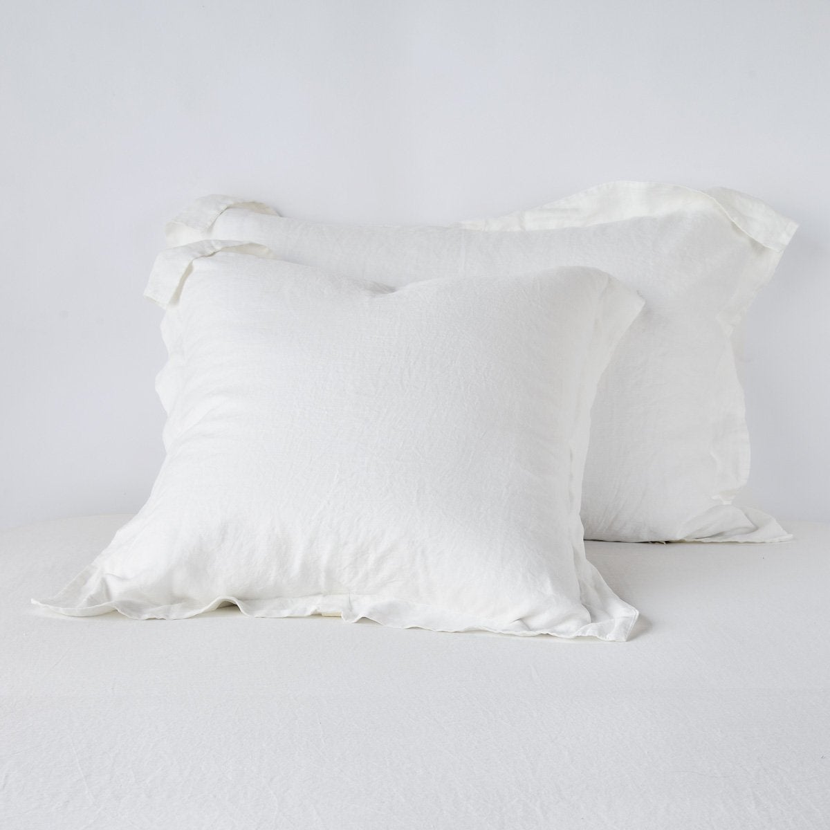 Linen Sham | Winter White | Two shams leaning upright against a white background.