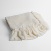 Loulah Baby Blanket | Winter White | an overhead shot of a folded silk velvet baby blanket with a raw-edged eyelash ruffle detail.