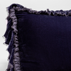 Loulah Sham | French Lavender | close up of the corner of a silk velvet pillow with raw edged ruffle detail.