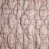 Luna Twin Coverlet | Rouge | A close up of quilted charmeuse fabric in rouge, a mid-tone blush pink.