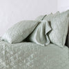 Luna shama with a matching coverlet and silk charmeuse sleeping pillow - eucalyptus, side view.