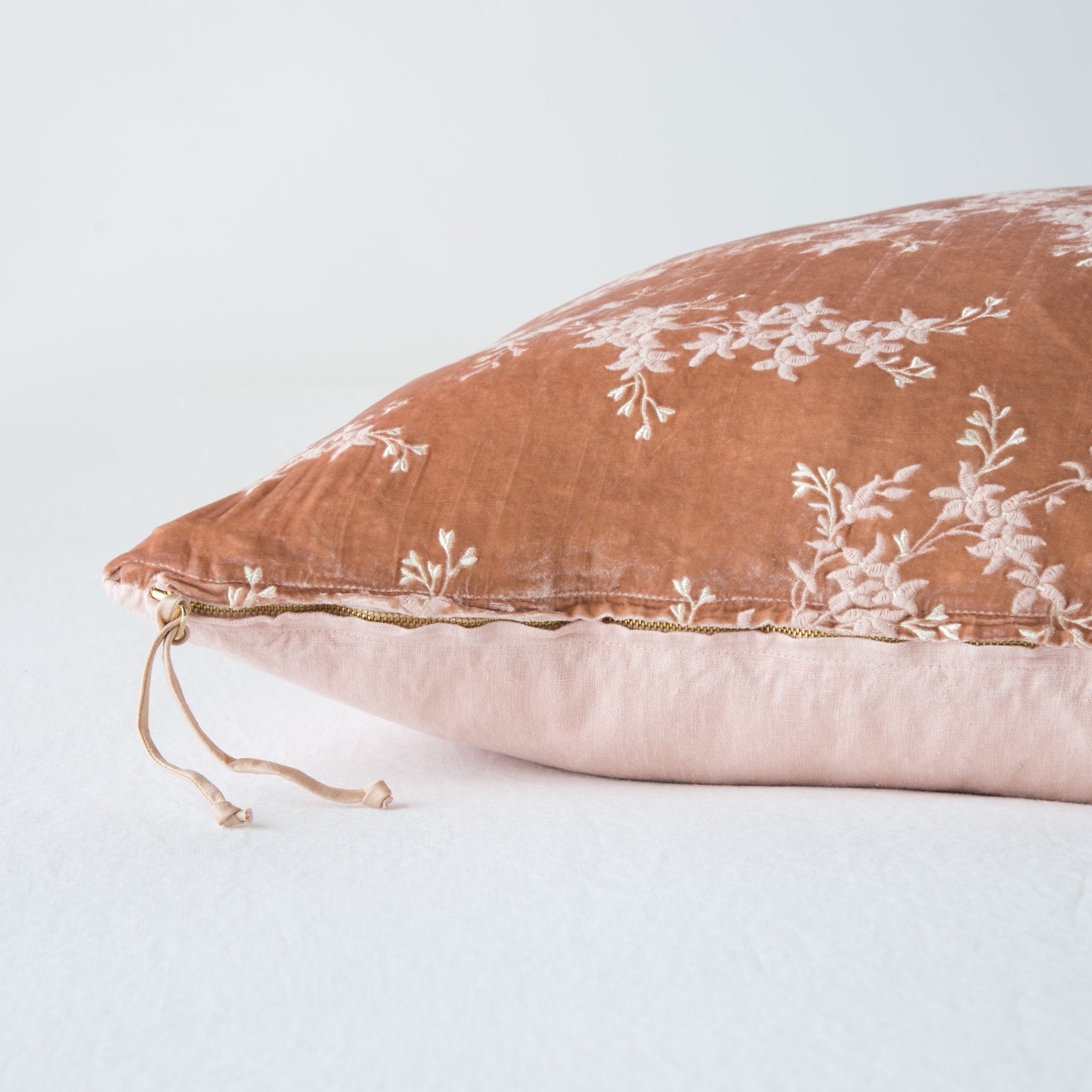 Lynette Sham | Rouge | Close-up side vew featuring brass zipper with charmeuse pull, and linen back.