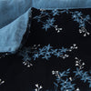 Lynette Blanket | Midnight | Close up of blanket, with a corner turned back to showcase the linen back - overhead view.