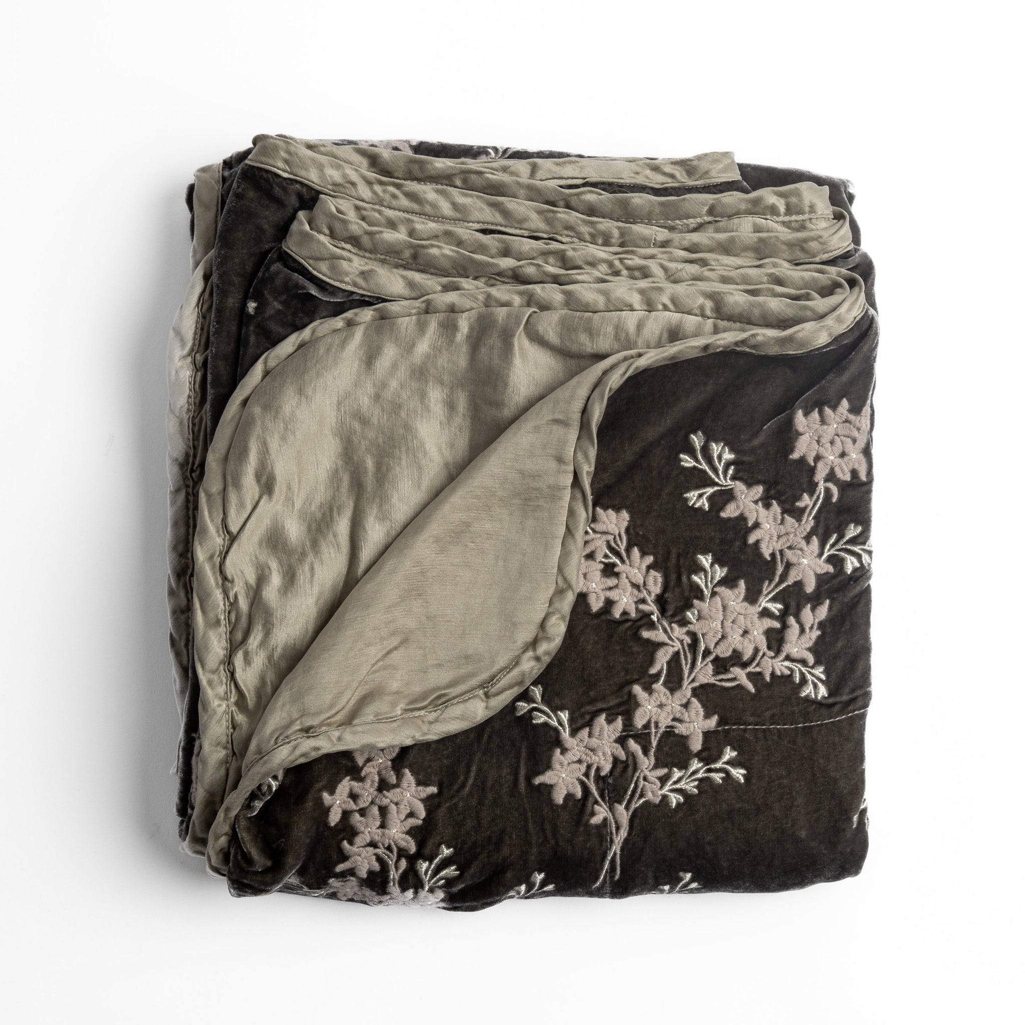 Lynette Blanket | Fog | overhead angle of the folded blanket with a corner pulled back to show the reverse and trim.