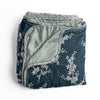 Lynette Blanket | Mineral | overhead angle of the folded blanket with a corner pulled back to show the reverse and trim.