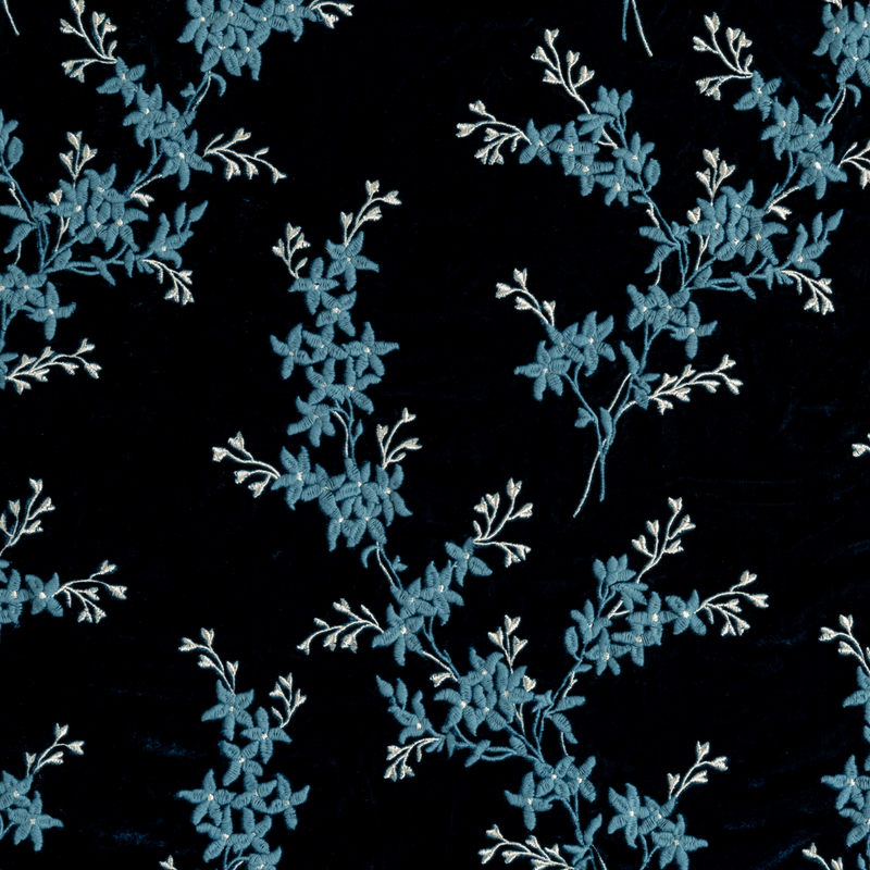 Lynette Baby Blanket | Cenote | A close up of embroidered silk velvet fabric in cenote, a vibrant, ocean-inspired blue-green.