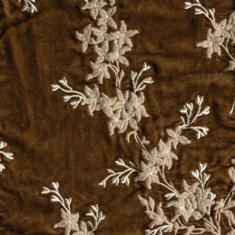 Lynette Blanket | Honeycomb | A close up of embroidered silk velvet fabric in honeycomb, a warm golden tone.