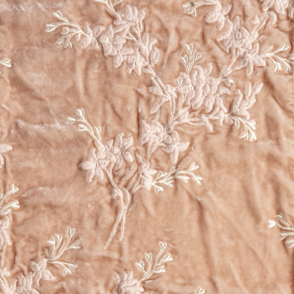 Lynette Sham | Pearl | A close up of embroidered silk velvet fabric in pearl, a nude-like, soft rose pink tone.